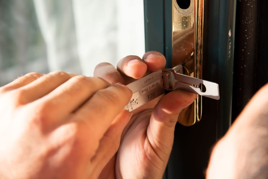 Locksmith working on a door lock